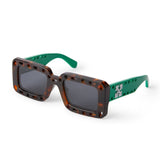 Havana acetate front with green temples Rectangular shape enhanced  with geometric cut outs  Contrast logo on temples Gray tinted lenses 100% UV protection Made in Italy Case and lens cloth included