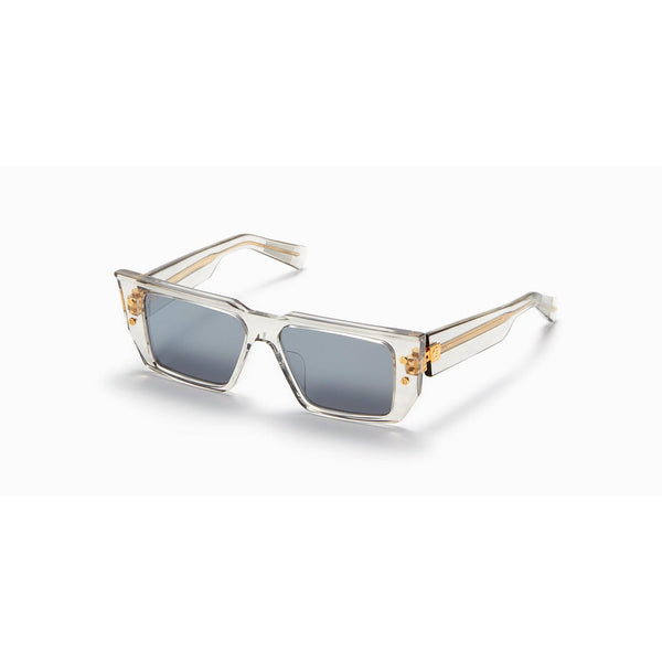 Clear acetate and gold toned titanium Rectangular frame  Wide temple style features gold toned Balmain logo Measurements: 54 Eye 17 Bridge 145 Temple Gray lenses with 100 % UV protection Made in Japan Case and lens cloth included