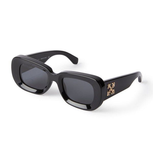 Black acetate frame Rounded elongated shape  Gold tone logo on temples Gray tinted lenses 100% UV protection Made in Italy Case and lens cloth included