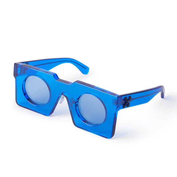 Blue acetate front Bold block shape Tonal logo on temples Blue tinted lenses 100% UV protection Made in Italy Case and lens cloth included