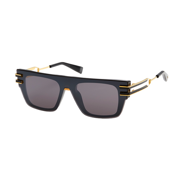 Black and gold toned titanium  Rectangular shape Wide style temples Solid tinted lenses 100% UV protection Made in Japan Case and lens cloth included
