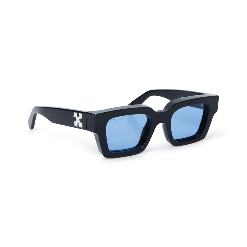 Black acetate frame Squared shape Contrast logo on temples Blue tinted lenses 100% UV protection Made in Italy Case and lens cloth included